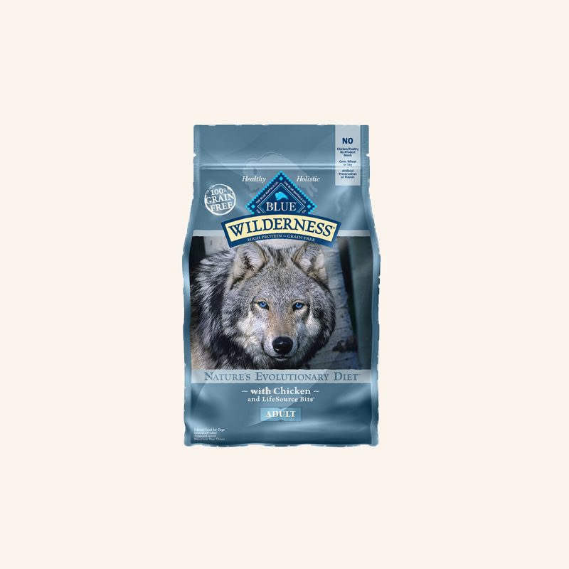 A bag of the old formula Blue Wilderness Nature's Evolutionary Diet dog food with Chicken, featuring a wolf on the packaging.