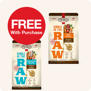 Two bags of 'Primal kibble in the raw' dog food with a sale $20 Off