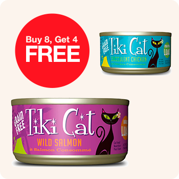 Two cans of Tiki Cat wild salmon, featuring a promotion