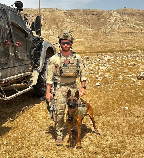K-9 Baco and military member handler