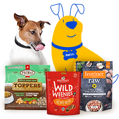 A small dog with brown and white fur is licking its lips while sitting next to various bags of pet food products. The products include Primal Freeze-Dried Raw Toppers, Stella & Chewy's Wild Weenies, and Instinct Raw Boost Mixers. To the right of the pet food products is a yellow Pet Supermarket Peticon dog illustration, wearing a blue collar with a "Pet Supermarket" tag.