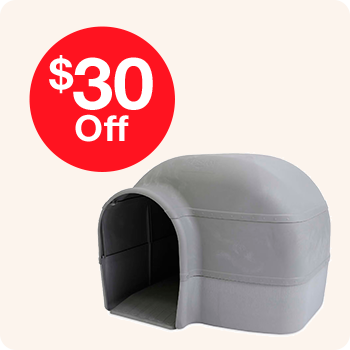  A grey dog house featuring a sign that reads "$30 off" prominently displayed on the front.