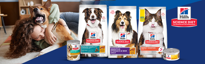 Hill's science diet logo and several dog and cat food bags with a lifestyle image of a woman on the floor hugging her dog