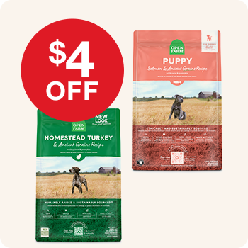 Two bags of Open Farm dog food – one for puppies and one in Homestead Turkey recipe – with a red circular label stating "$4 OFF".